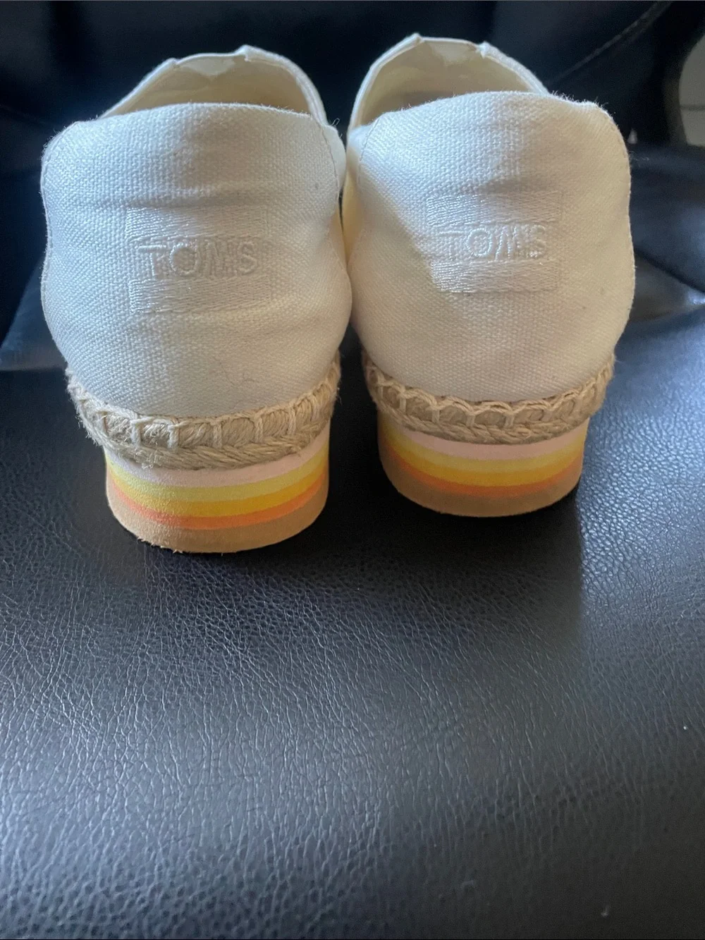 TOMS Kids Cream Canvas Slip-On with Yellow & Orange Striped Sole